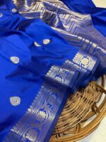 "Fighter blue Banarasi soft silk saree with strawberry pink booti motifs and traditional zari weaving – a vibrant and elegant saree ideal for festive wear and day functions."