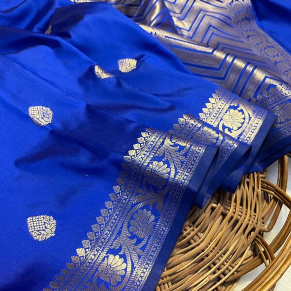 "Fighter blue Banarasi soft silk saree with strawberry pink booti motifs and traditional zari weaving – a vibrant and elegant saree ideal for festive wear and day functions."