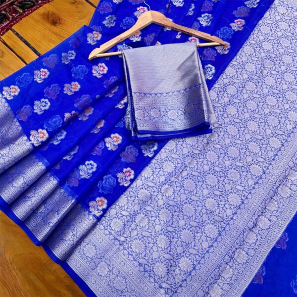 Neelkamal Kora Organza Banarasi Saree – Floral Weave with Silver Zari Border