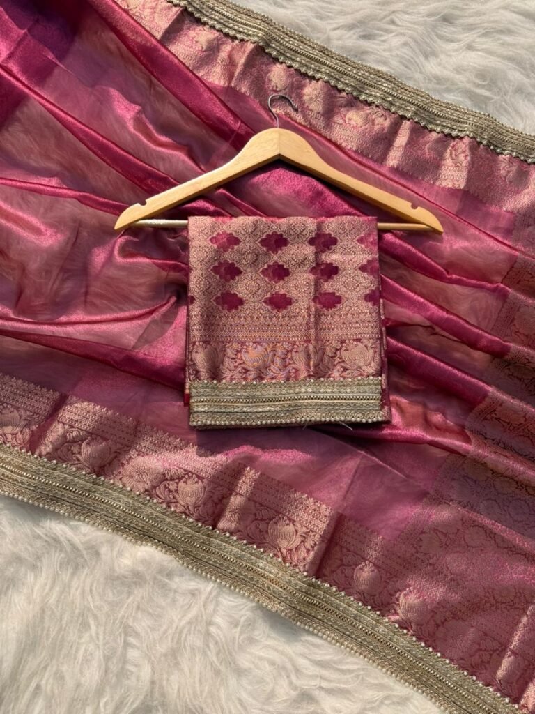 Woman wearing exclusive Rajkumari gulabi tissue silk saree for wedding and festive ethnic styling