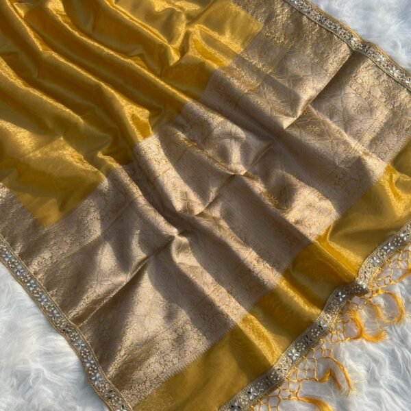 Shimmery gold tissue silk saree with intricate woven border and matching blouse piece from Miraya Collection