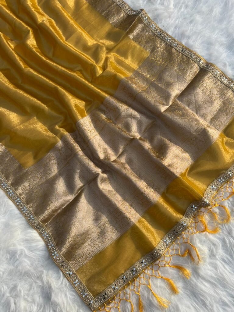 Shimmery gold tissue silk saree with intricate woven border and matching blouse piece from Miraya Collection