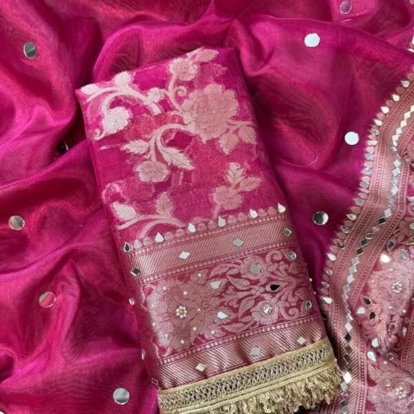 Woman wearing pink designer saree with heavy allover mirror work for wedding and festive partywear styling